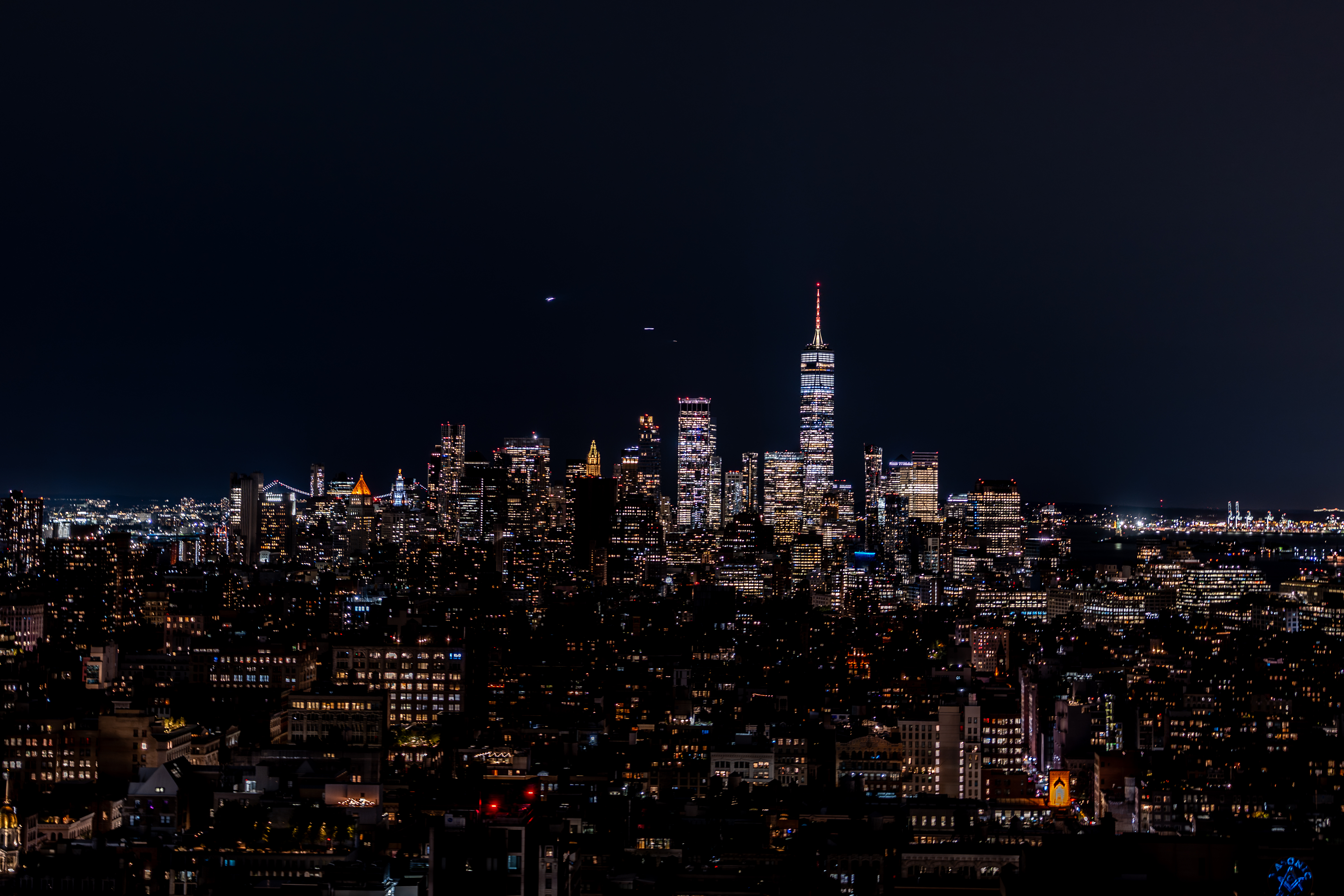 The lower Manhattan skyline lit up at night
